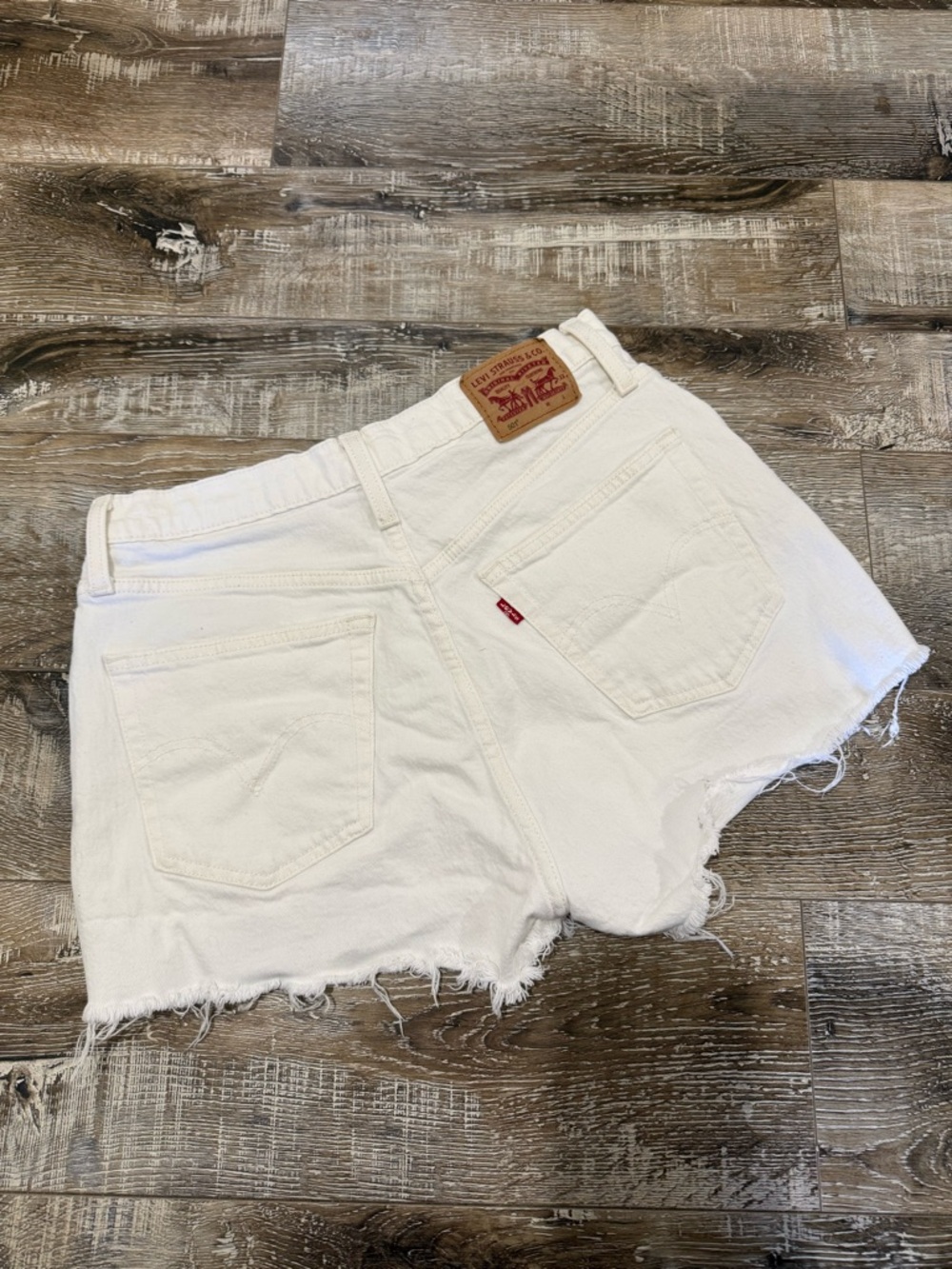 Levi's White Cutoff Denim Shorts with Frayed Hem